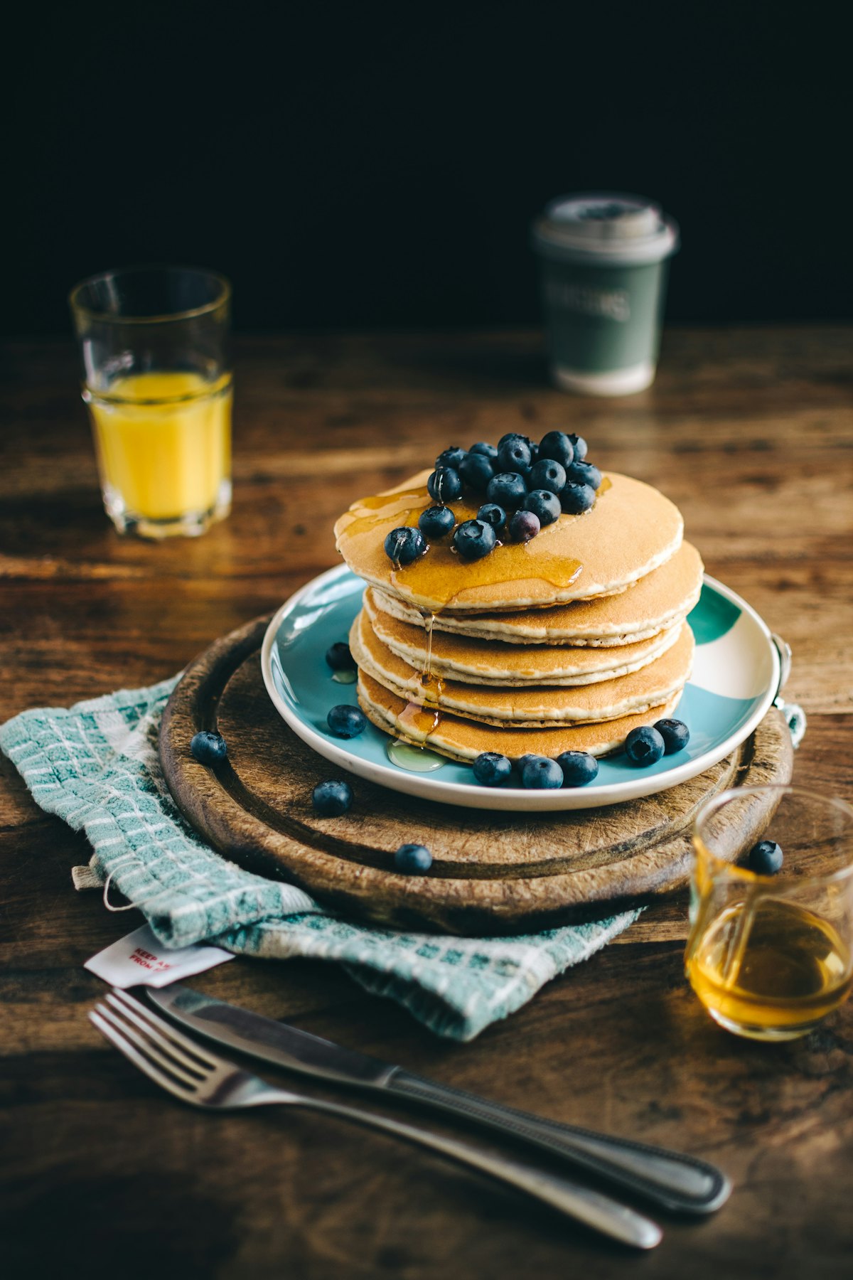 Stack of pancakes with blueberries and syrup
